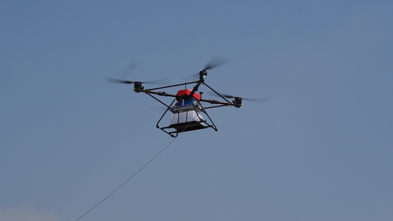 KTD-10 hovering in the air with its tether cable connected to the ground