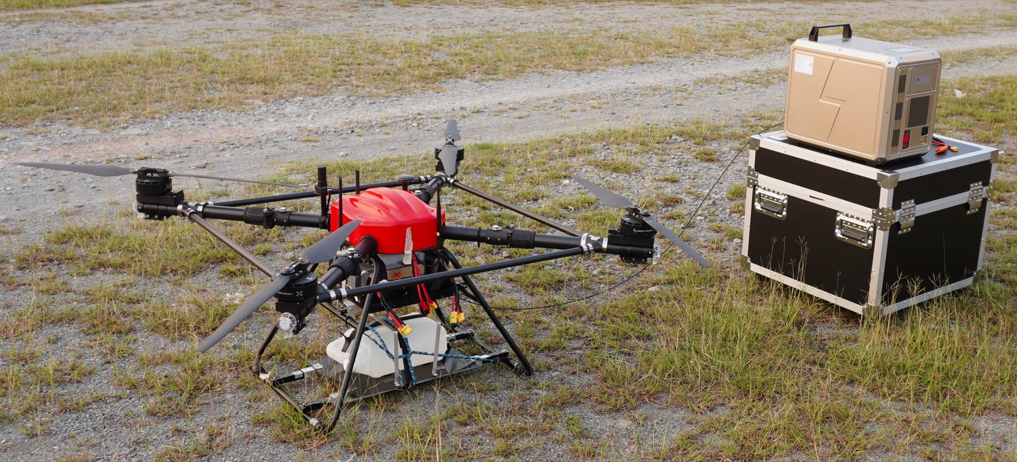 Keppler Drone KTD-10 tethered quadcopter next to its ground tether station